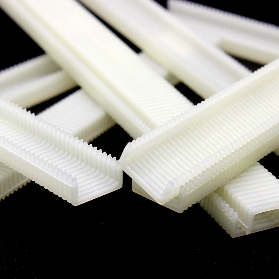 Polymer Composite Staples Close Up крупним планом полімерних композитних скоб 19 калібру