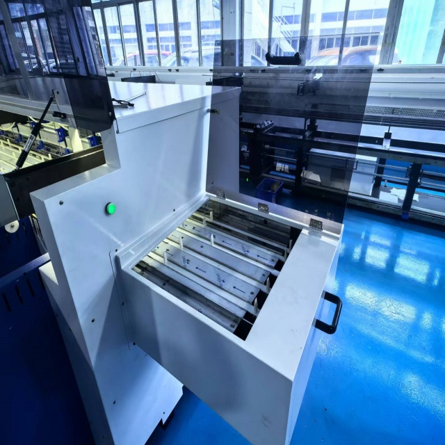 stasiun Manual tina mesin collator