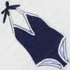 Ventilabis sursum nigrum et album una pars swimsuit